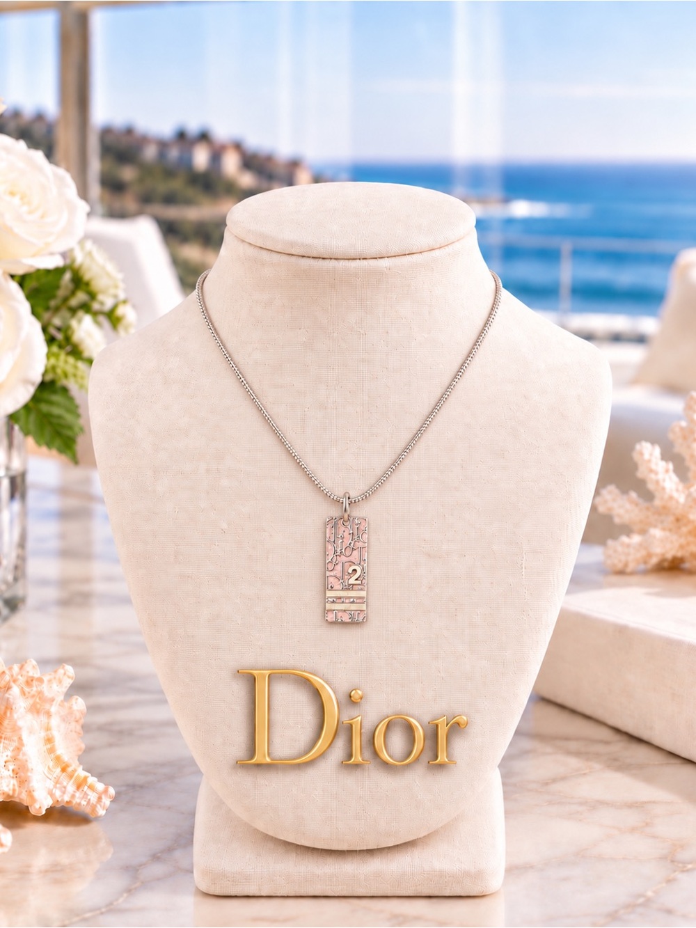 Christian Dior Trotter Pink pendant necklace.